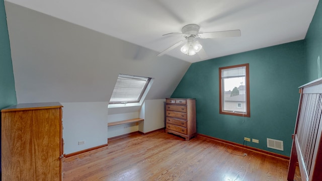 3354 N Overhill Ave, Chicago, IL 60634 - bonus room with a ceiling fan, wood finished floors, and vaulted ceiling