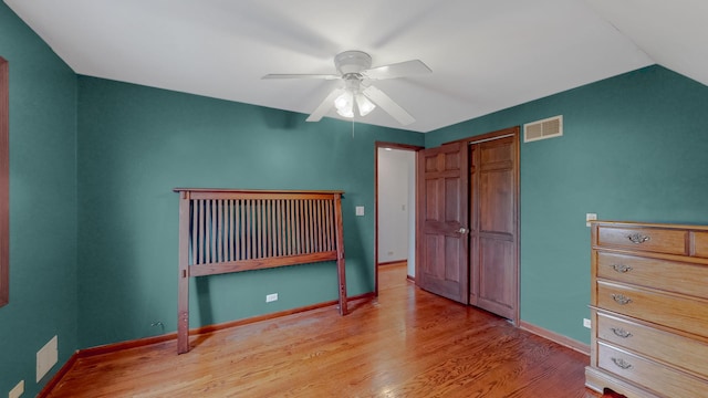 3354 N Overhill Ave, Chicago, IL 60634 - unfurnished bedroom with wood finished floors, ceiling fan, and a closet