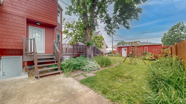 3354 N Overhill Ave, Chicago, IL 60634 - view of yard with a wooden deck and an outdoor structure