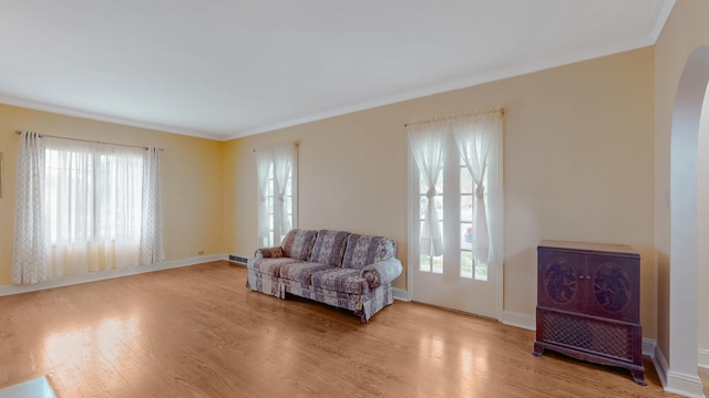 3354 N Overhill Ave, Chicago, IL 60634 - sitting room with arched walkways, healthy amount of natural light, wood finished floors, and ornamental molding