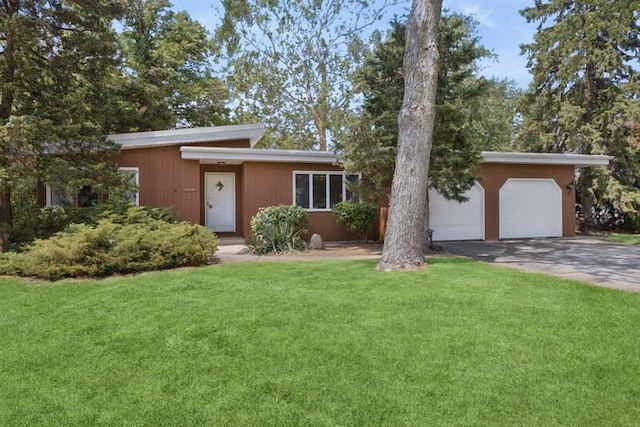 7370 Forest Hill Rd, Burr Ridge, IL 60527 - mid-century modern home featuring driveway, a garage, and a front yard