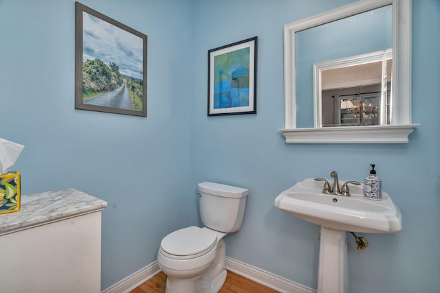 2319 Hutchison Rd, Flossmoor, IL 60422 - half bathroom with toilet and wood finished floors