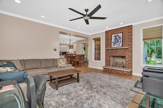 2319 Hutchison Rd, Flossmoor, IL 60422 - living area with wood finished floors, a ceiling fan, ornamental molding, recessed lighting, and a brick fireplace