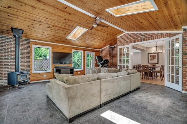 2319 Hutchison Rd, Flossmoor, IL 60422 - living room with a skylight, brick wall, vaulted ceiling, wooden ceiling, and a wood stove