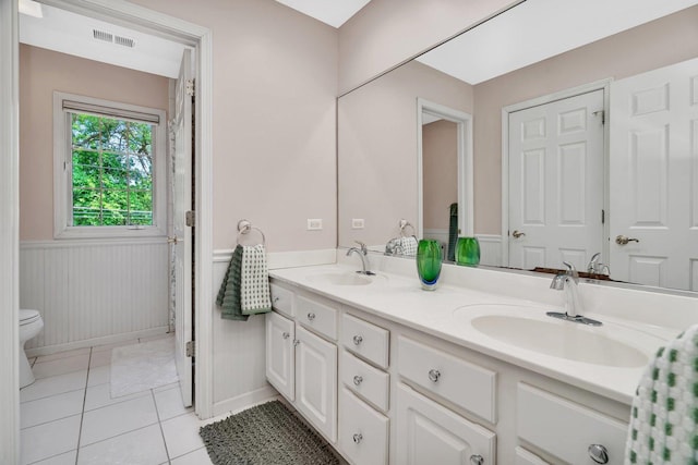 2319 Hutchison Rd, Flossmoor, IL 60422 - bathroom with a wainscoted wall, double vanity, and tile patterned floors