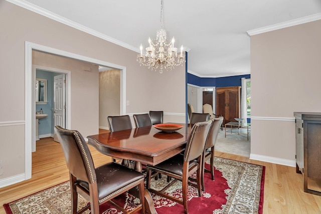 2319 Hutchison Rd, Flossmoor, IL 60422 - dining room featuring a chandelier, light wood-style flooring, and crown molding