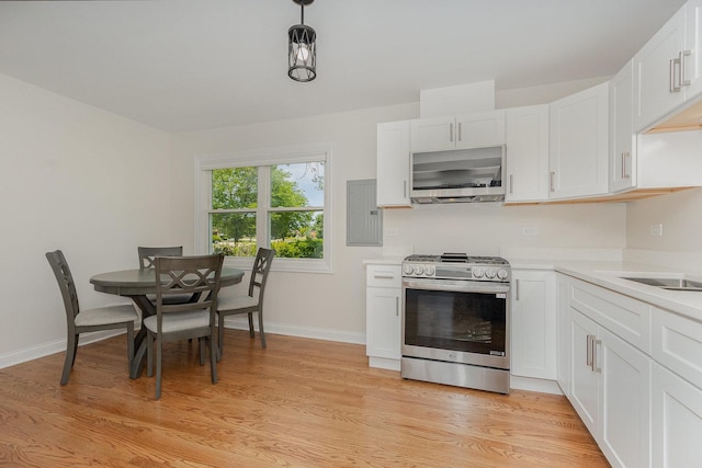 8954 Southfield Dr, Bridgeview, IL 60455 - kitchen featuring stainless steel gas range oven, light wood-style flooring, white cabinets, light countertops, and ventilation hood