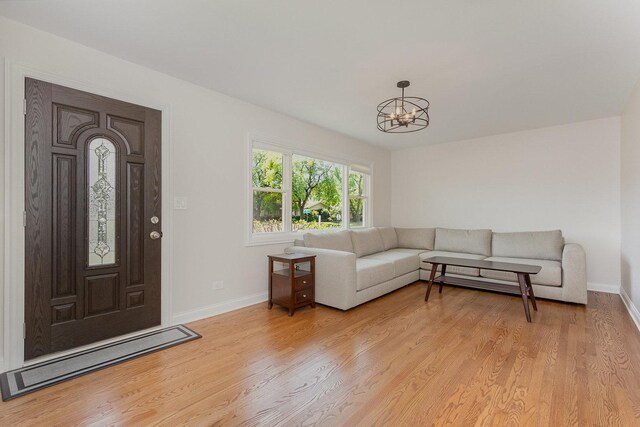 8954 Southfield Dr, Bridgeview, IL 60455 - living area featuring a chandelier and light wood-type flooring