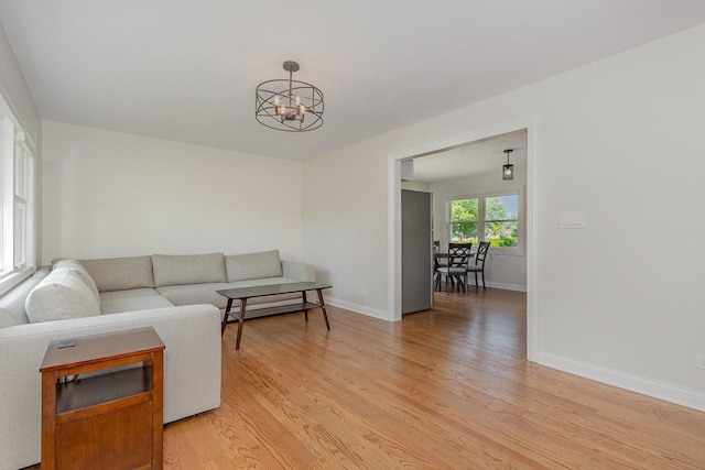 8954 Southfield Dr, Bridgeview, IL 60455 - living room with a chandelier and light wood-style floors