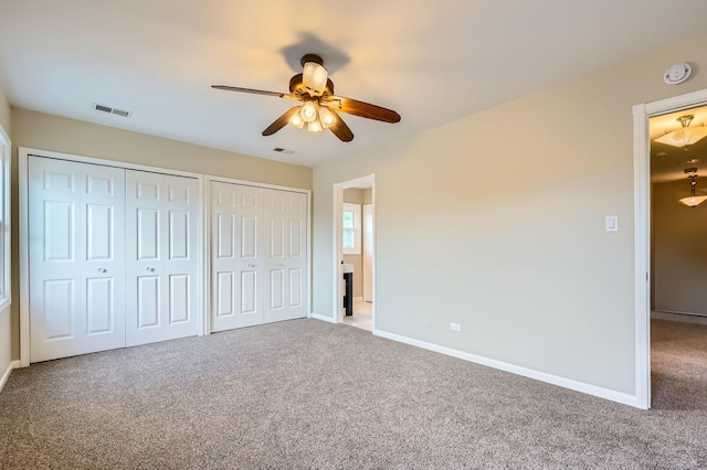 918 Carol Ln, Crete, IL 60417 - unfurnished bedroom with two closets, carpet flooring, and ceiling fan