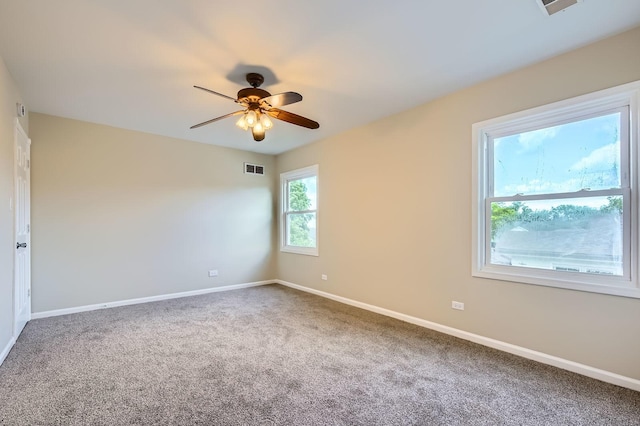 918 Carol Ln, Crete, IL 60417 - carpeted empty room featuring a ceiling fan and baseboards