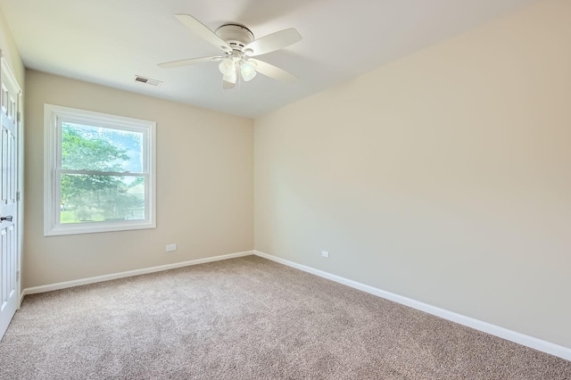 918 Carol Ln, Crete, IL 60417 - carpeted spare room with baseboards and ceiling fan