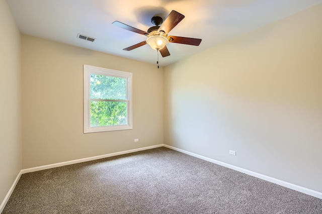 918 Carol Ln, Crete, IL 60417 - carpeted spare room with baseboards and a ceiling fan