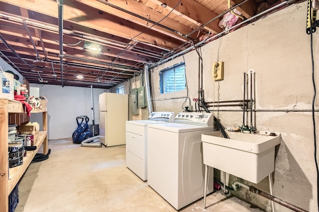 918 Carol Ln, Crete, IL 60417 - below grade area featuring freestanding refrigerator, washing machine and dryer, and electric panel