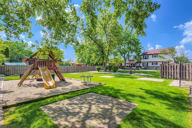 918 Carol Ln, Crete, IL 60417 - fenced backyard with a playground and a patio