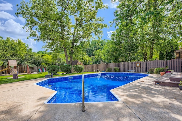 918 Carol Ln, Crete, IL 60417 - view of pool featuring a fenced backyard, a playground, a patio, and view of wooded area