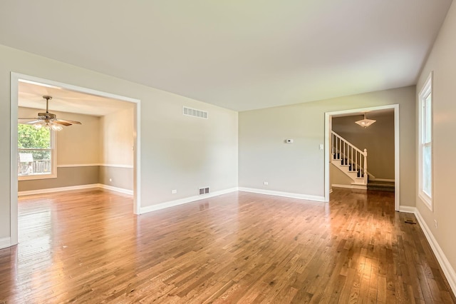 918 Carol Ln, Crete, IL 60417 - spare room with hardwood / wood-style floors, stairs, and a ceiling fan