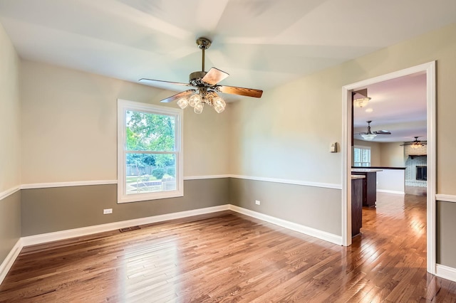 918 Carol Ln, Crete, IL 60417 - empty room with a ceiling fan and hardwood / wood-style floors