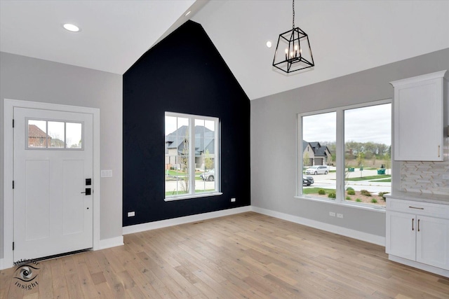 16451 Kayla Dr, Lemont, IL 60439 - entryway featuring a chandelier, high vaulted ceiling, light wood finished floors, plenty of natural light, and recessed lighting