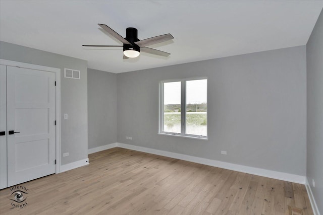 16451 Kayla Dr, Lemont, IL 60439 - unfurnished bedroom with light wood-style floors, a closet, and ceiling fan