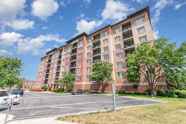 1199 E Port Clinton Rd Unit 305, Vernon Hills, IL 60061 - view of apartment building / complex with uncovered parking