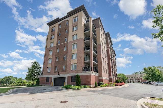 1199 E Port Clinton Rd Unit 305, Vernon Hills, IL 60061 - view of building exterior with a garage
