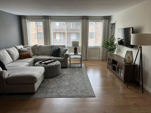 110 S Dunton Ave Unit 4G, Arlington Heights, IL 60005 - living room featuring baseboards and wood finished floors