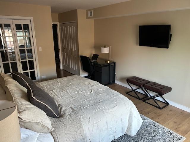 110 S Dunton Ave Unit 4G, Arlington Heights, IL 60005 - bedroom with wood finished floors and baseboards