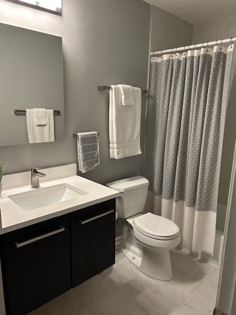 110 S Dunton Ave Unit 4G, Arlington Heights, IL 60005 - bathroom with vanity and shower / bath combination with curtain