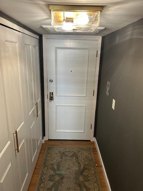 110 S Dunton Ave Unit 4G, Arlington Heights, IL 60005 - doorway featuring wood finished floors and baseboards