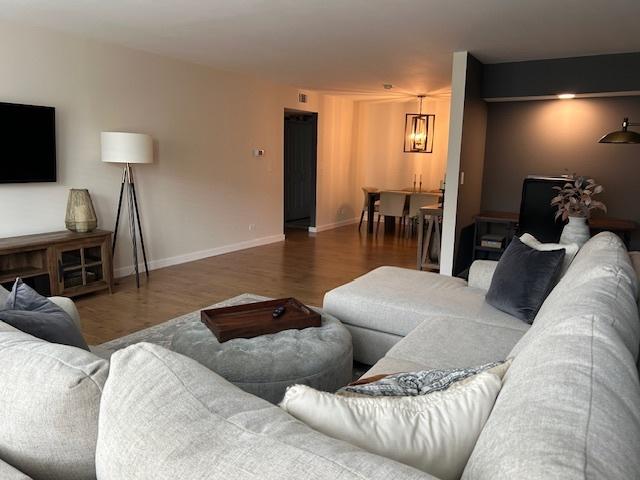 110 S Dunton Ave Unit 4G, Arlington Heights, IL 60005 - living room with wood finished floors and baseboards