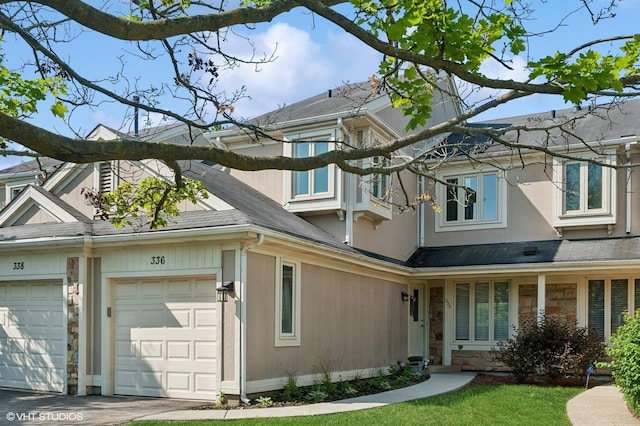 336 Redwing Dr Unit 18-3, Deerfield, IL 60015 - view of side of property with stone siding and a garage