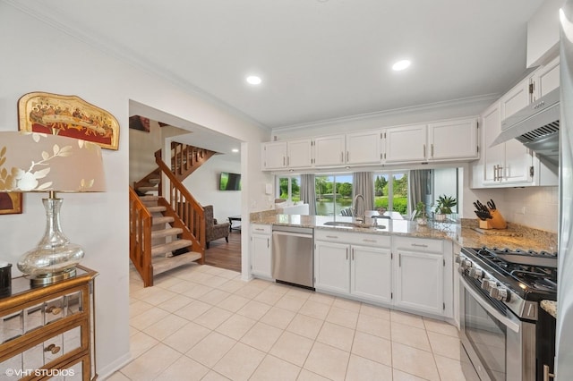 336 Redwing Dr Unit 18-3, Deerfield, IL 60015 - kitchen featuring appliances with stainless steel finishes, ornamental molding, white cabinetry, light stone countertops, and recessed lighting