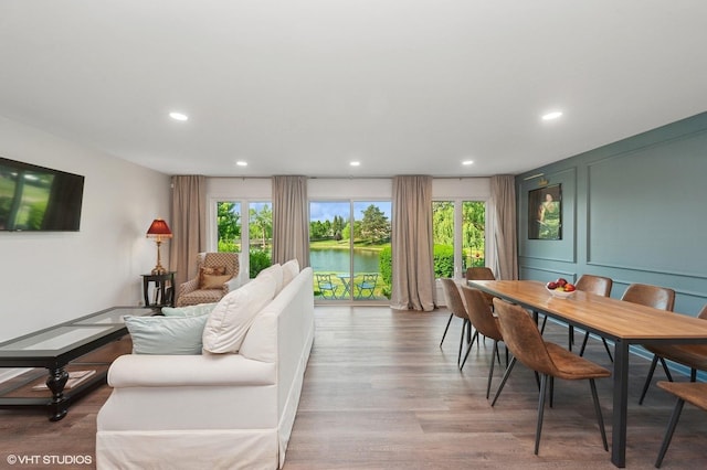 336 Redwing Dr Unit 18-3, Deerfield, IL 60015 - living room featuring healthy amount of natural light, wood finished floors, recessed lighting, and a water view