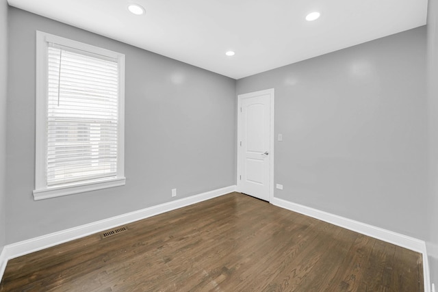 5424 N Lotus Ave, Chicago, IL 60630 - unfurnished room with dark wood-style floors and recessed lighting