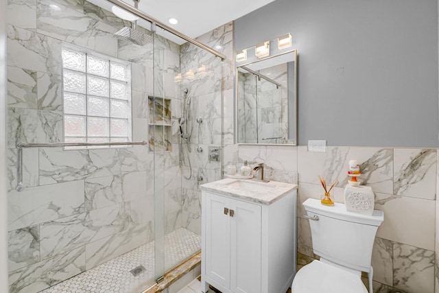 5424 N Lotus Ave, Chicago, IL 60630 - bathroom featuring a marble finish shower, vanity, and tile walls
