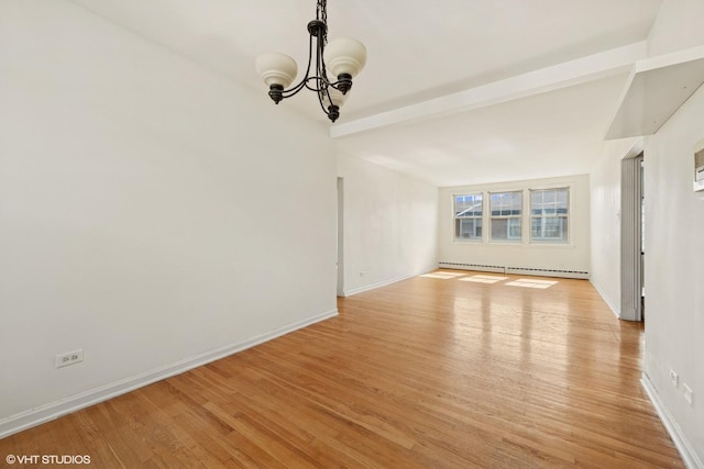 2424 W Farragut Ave Unit 3B, Chicago, IL 60625 - empty room with baseboard heating, light wood-type flooring, a chandelier, and beamed ceiling