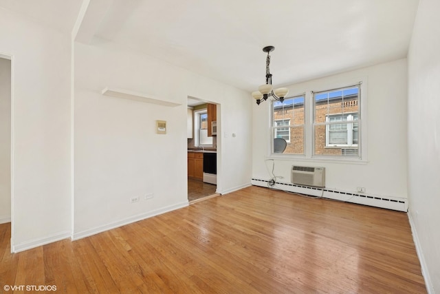 2424 W Farragut Ave Unit 3B, Chicago, IL 60625 - unfurnished dining area featuring baseboard heating, light wood-style floors, a wall unit AC, and a chandelier