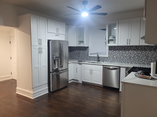8629 S Union Ave, Chicago, IL 60620 - kitchen with appliances with stainless steel finishes, ceiling fan, dark wood-type flooring, light countertops, and tasteful backsplash