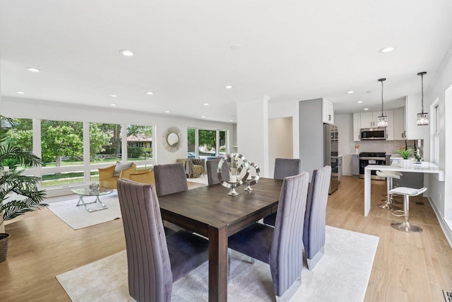 7248 N Kildare Ave, Lincolnwood, IL 60712 - dining space featuring light wood-type flooring and recessed lighting