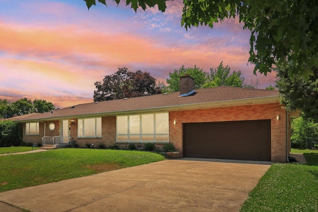 7248 N Kildare Ave, Lincolnwood, IL 60712 - ranch-style home featuring brick siding, a chimney, driveway, a yard, and an attached garage