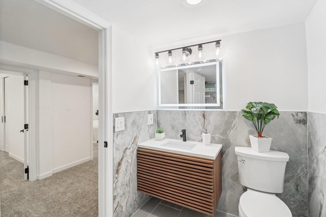 7248 N Kildare Ave, Lincolnwood, IL 60712 - bathroom with tile walls, vanity, and a wainscoted wall