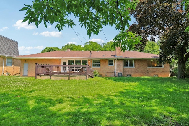 7248 N Kildare Ave, Lincolnwood, IL 60712 - back of property featuring a lawn, brick siding, a wooden deck, and a chimney