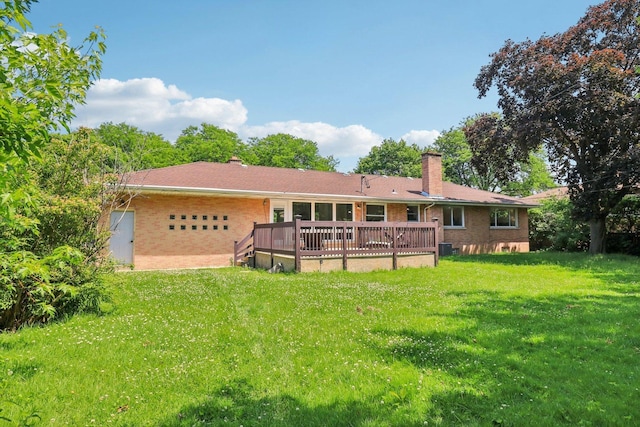 7248 N Kildare Ave, Lincolnwood, IL 60712 - back of house featuring a chimney, brick siding, a wooden deck, and a lawn