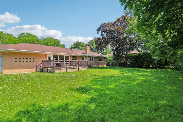 7248 N Kildare Ave, Lincolnwood, IL 60712 - view of grassy yard with a wooden deck