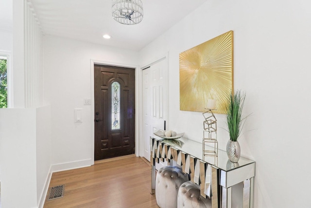 7248 N Kildare Ave, Lincolnwood, IL 60712 - entryway featuring wood finished floors, a chandelier, and recessed lighting