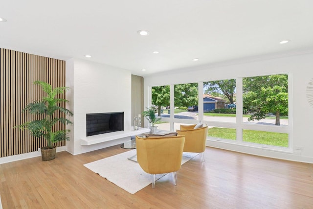 7248 N Kildare Ave, Lincolnwood, IL 60712 - living room with wood finished floors, a large fireplace, and recessed lighting