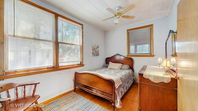 1320 Oak Park Ave, Berwyn, IL 60402 - bedroom featuring wood finished floors, a ceiling fan, and crown molding