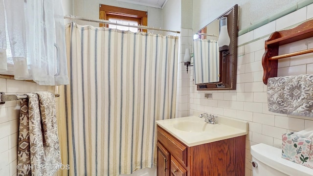 1320 Oak Park Ave, Berwyn, IL 60402 - bathroom with tile walls, vanity, and a shower with curtain