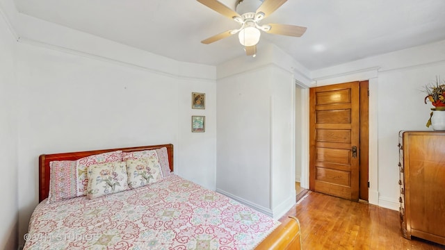1320 Oak Park Ave, Berwyn, IL 60402 - bedroom with light wood-type flooring and a ceiling fan